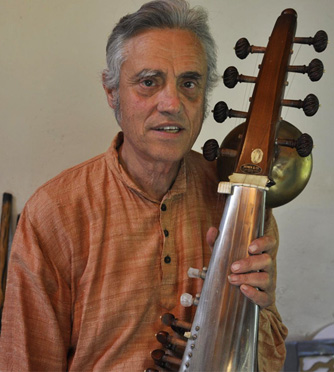 photo of Montino Bourbon playing an instrument he invented